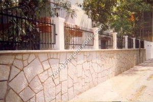 Stone compound wall (14) 
